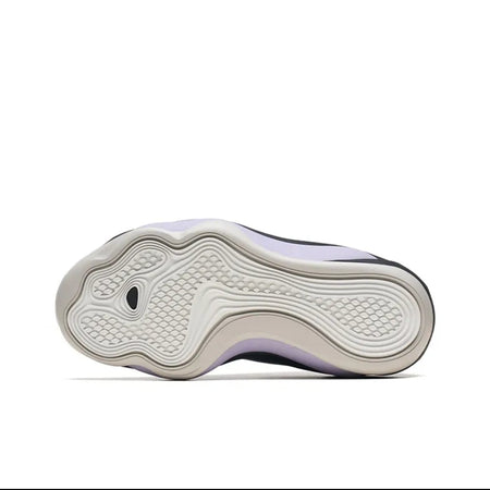 A close-up of a shoe sole, showing a white textured outsole with a light gray and white patterned upper section and subtle lavender-purple accents along the sides.