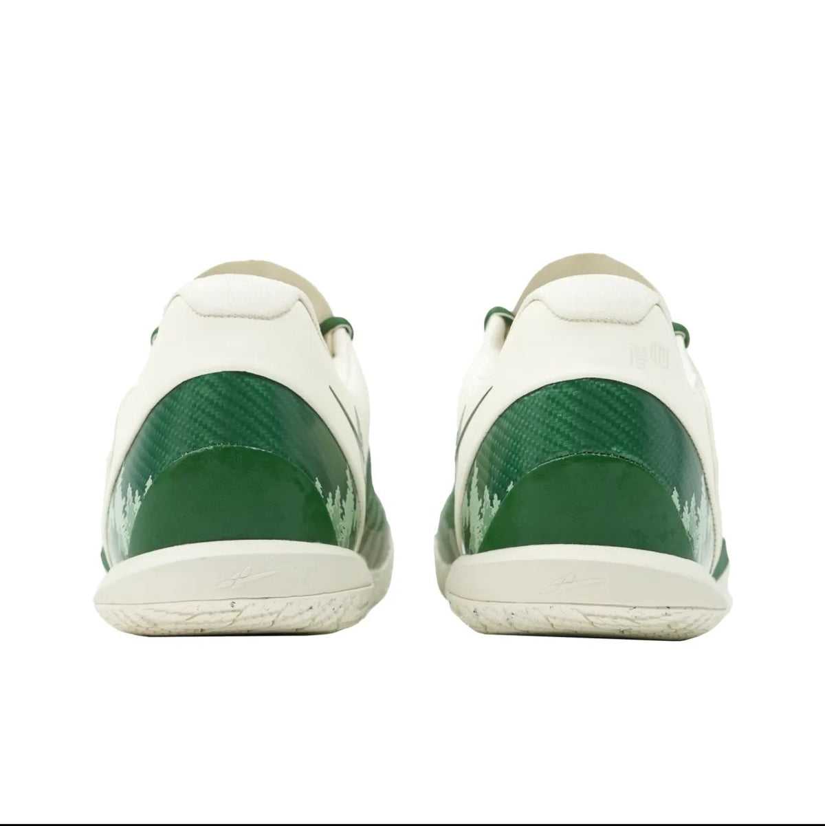 A pair of white sneakers shown from the back, featuring glossy dark green heel panels and white soles, displayed on a white background within a mobile app screenshot.