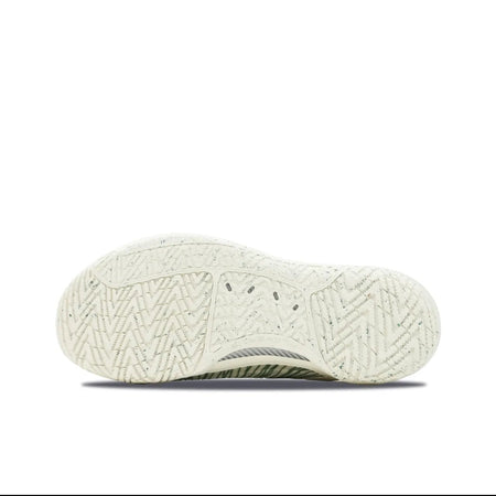 A close-up of a shoe's textured white outsole, shown against a white background with black bars at the top and bottom of the screenshot.