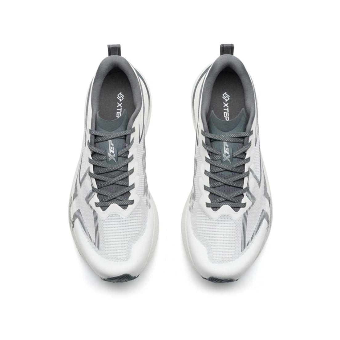 A pair of white and gray athletic sneakers shown from a top-down view on a plain white background, with black letterboxing bars at the top and bottom of the screenshot.