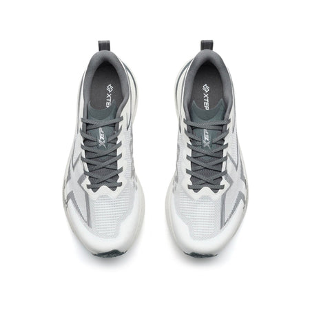 A pair of white and gray athletic sneakers shown from a top-down view on a plain white background, with black letterboxing bars at the top and bottom of the screenshot.