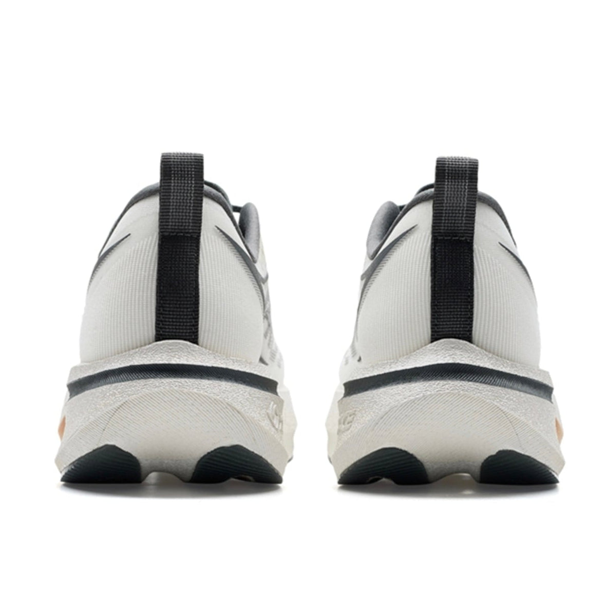 A pair of white low-top sneakers shown from the back, featuring black heel pulls and black outsole details, displayed on a white background within a mobile app screenshot.