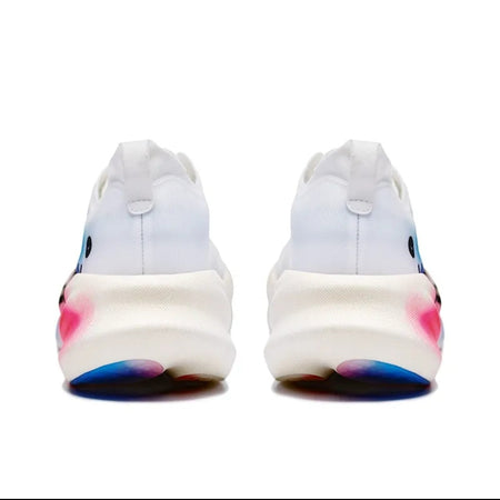 A pair of white athletic sneakers shown from the back, featuring a chunky white midsole and colorful gradient outsoles with pink, blue, and purple tones.