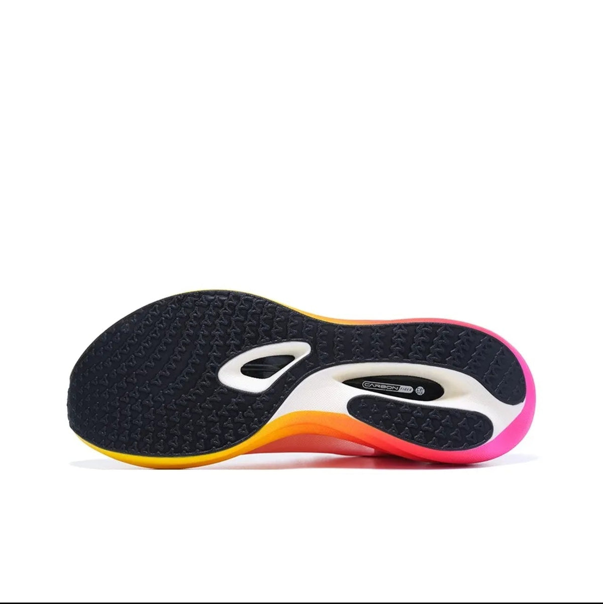 A close-up of a shoe sole showing a black textured outsole with a white and black central logo area and a bright gradient edge in orange, yellow, and pink, displayed on a white background.