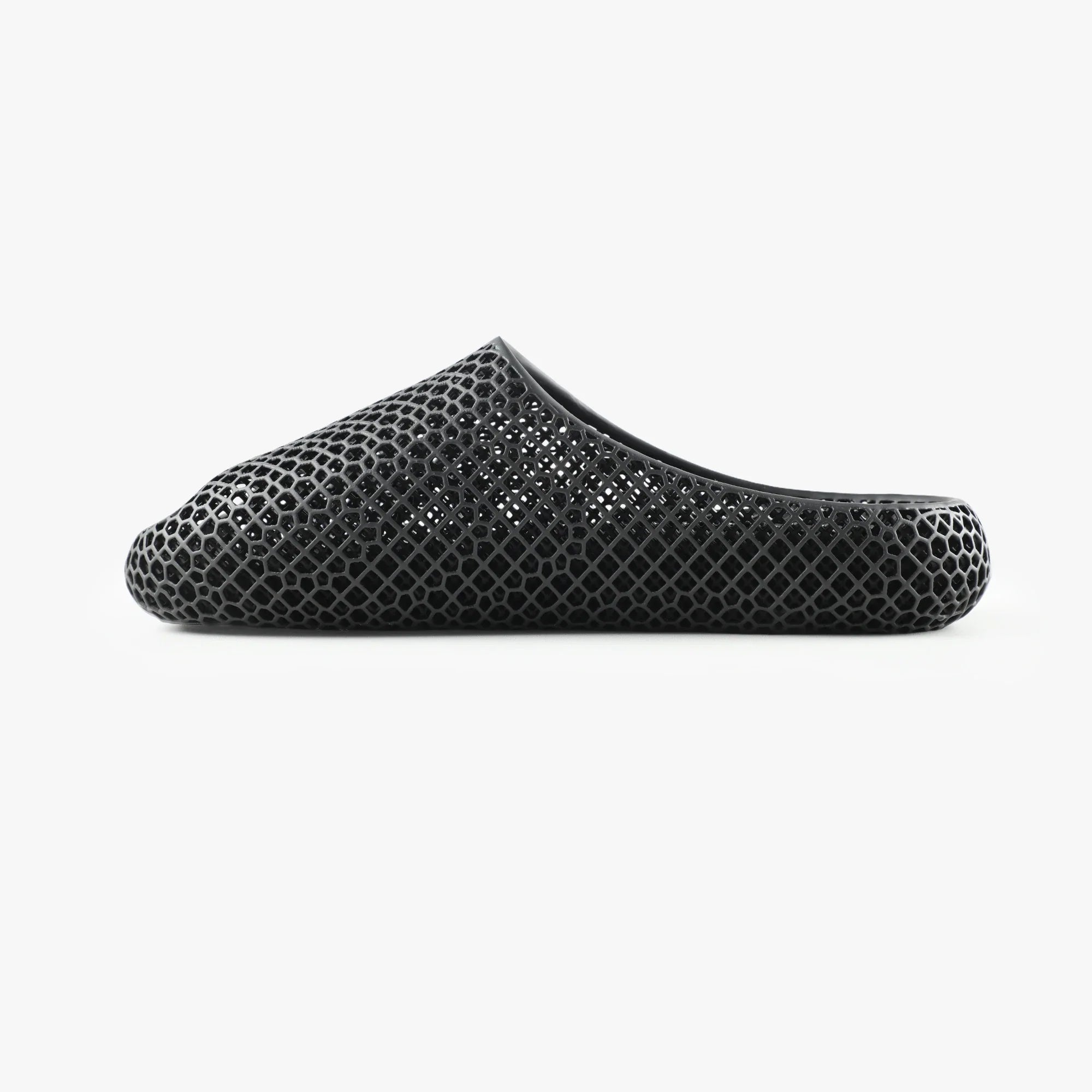 3D printed slippers, black side view with textured strap and open toe
